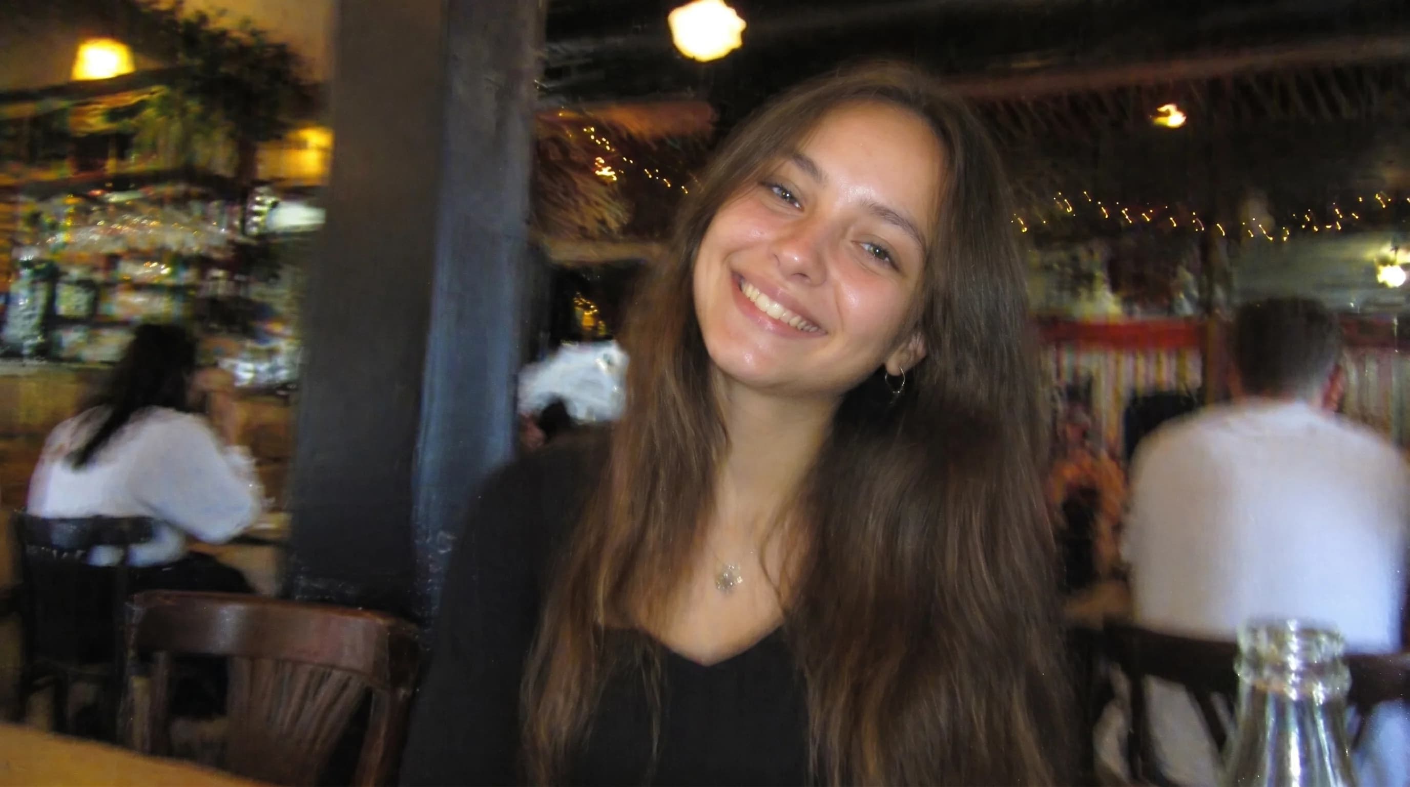 Slightly blurry portrait sharpened with cleaner facial definition
